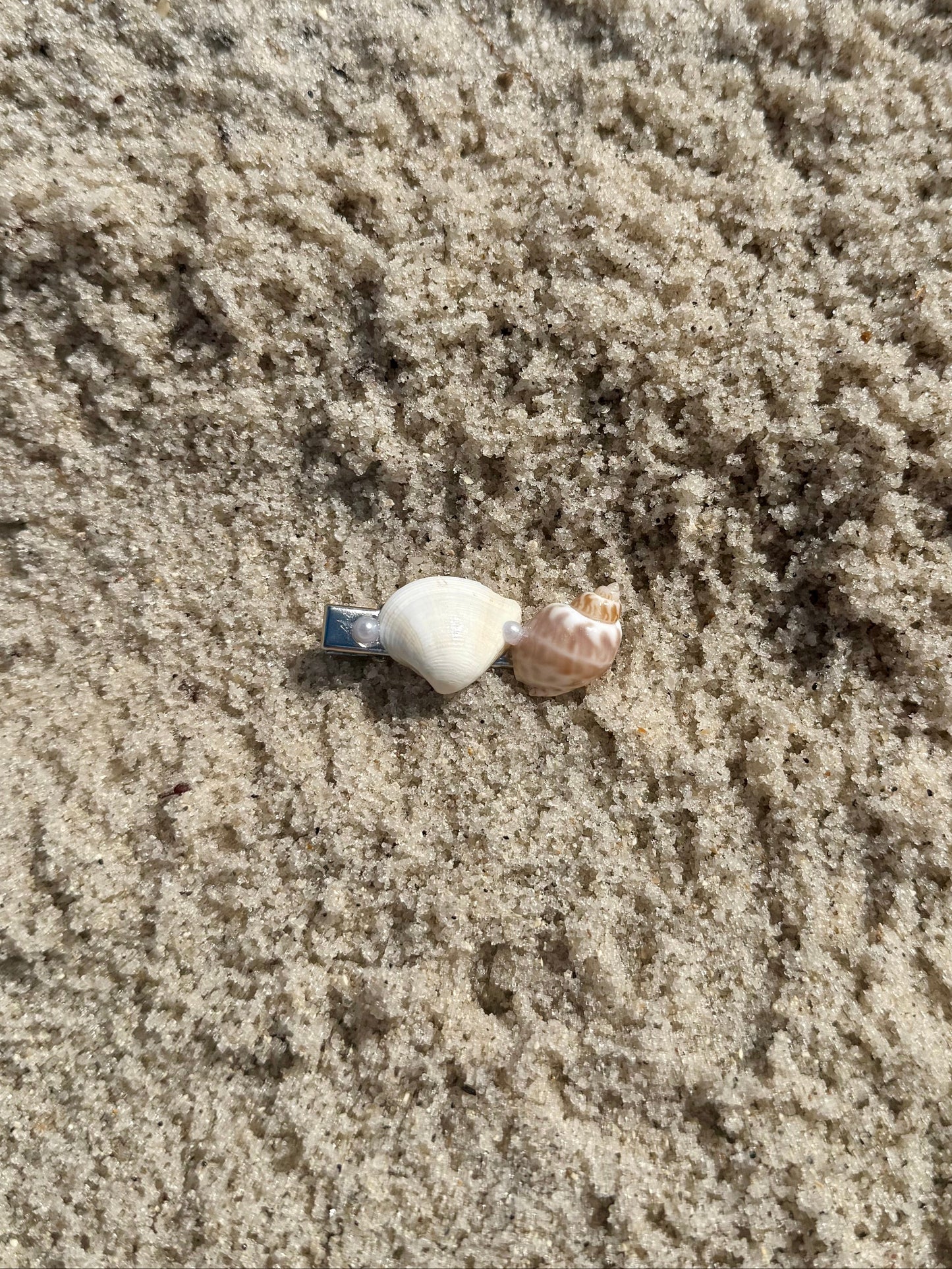 seashell hair clip on the sand