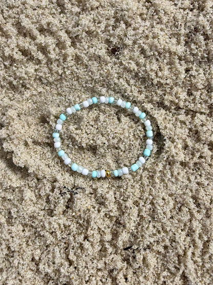 Beaded bracelet on sand