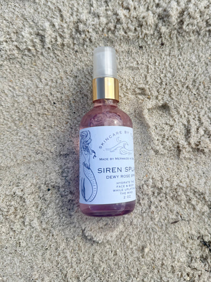 Makeup setting spray on sandy background