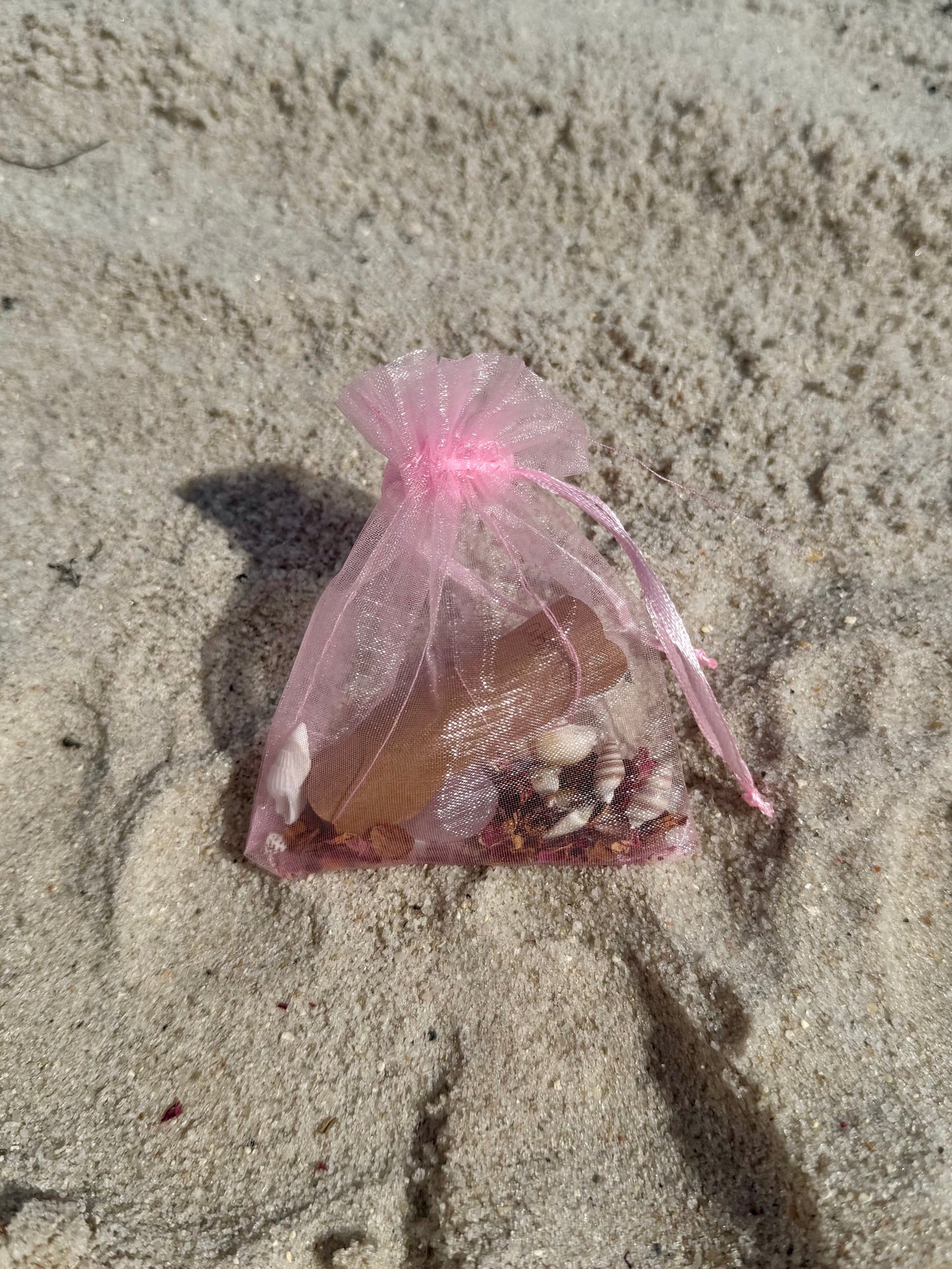 self love spell pouch completed in the sand